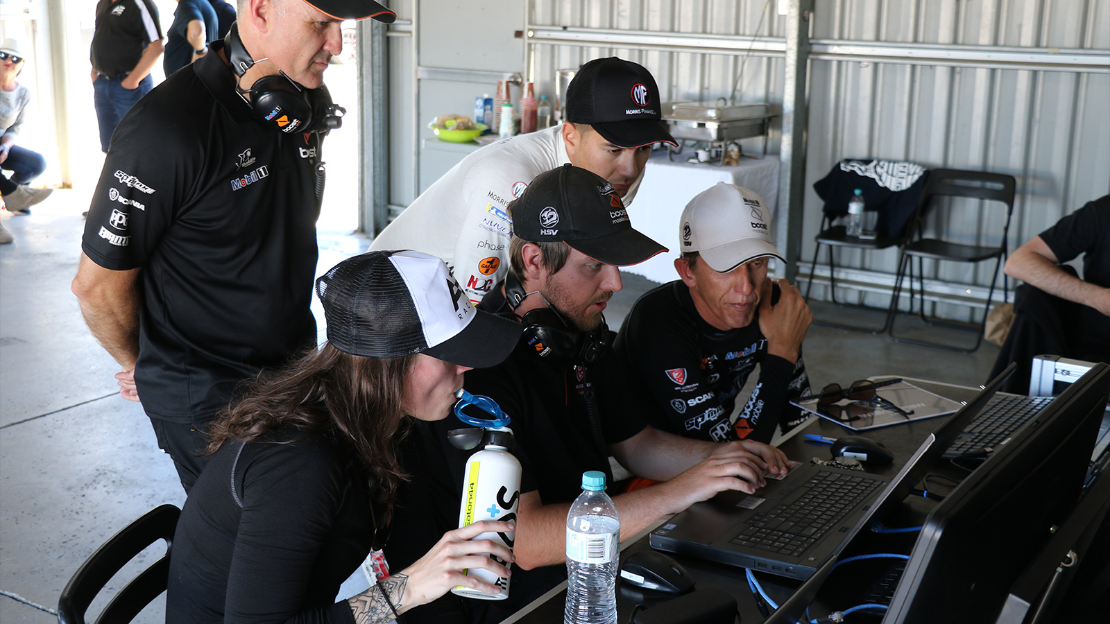 Eaton and Evans study the data with Warren Luff.